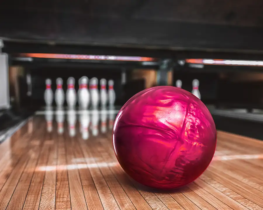 Close-up of a red bowling ball ready to strike the pins at Championship Lanes in Anderson, IN