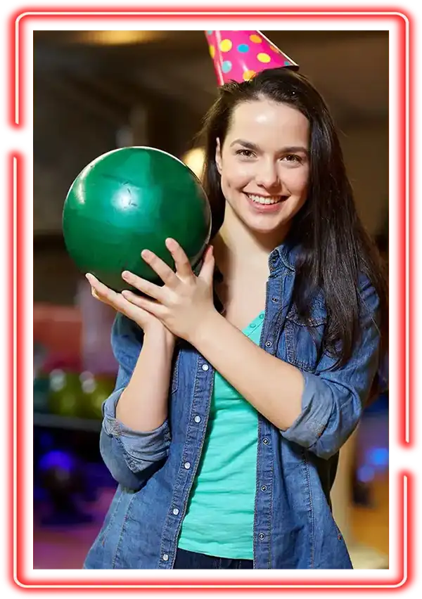 Young Woman celebrating a birthday party with a bowling ball at Championship Lanes in Anderson, IN