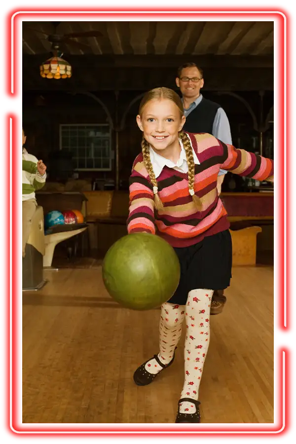 Young girl bowling in a classic lane setting at Championship Lanes in Anderson, IN - Family Bowling Party