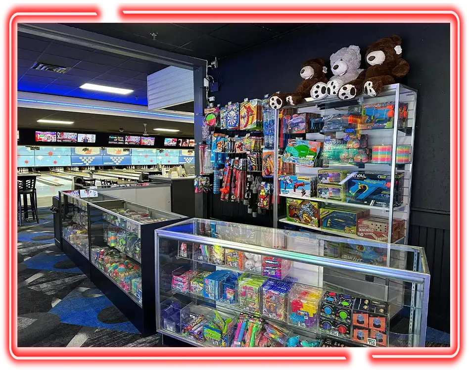 Prize counter stocked with toys and candy near the lanes at Championship Lanes Game Room in Anderson, IN