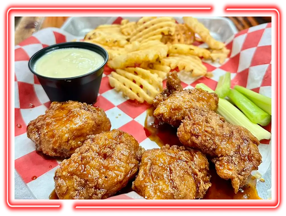 Crispy chicken wings with waffle fries and dipping sauce at Blaze Brew Pub inside Championship Lanes in Anderson, IN
