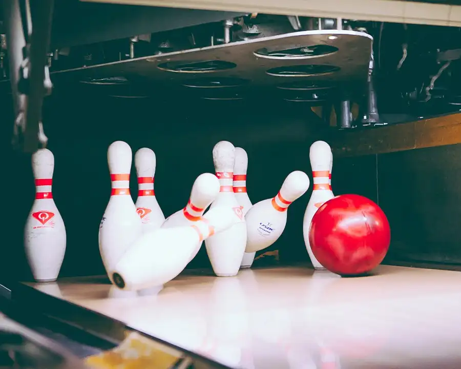 Bowling ball striking pins mid-roll at Championship Lanes in Anderson, IN