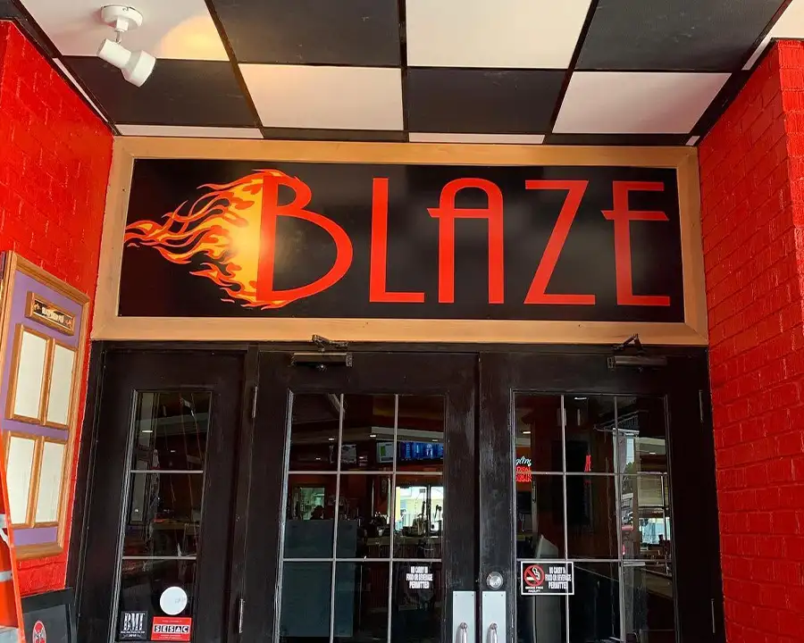 Blaze sign above the entrance doors for Blaze Brew Pub at Championship Lanes in Anderson, IN - Events By Blaze, catering